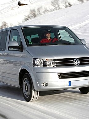 an image of a vw caravelle minibus travelling on snow
